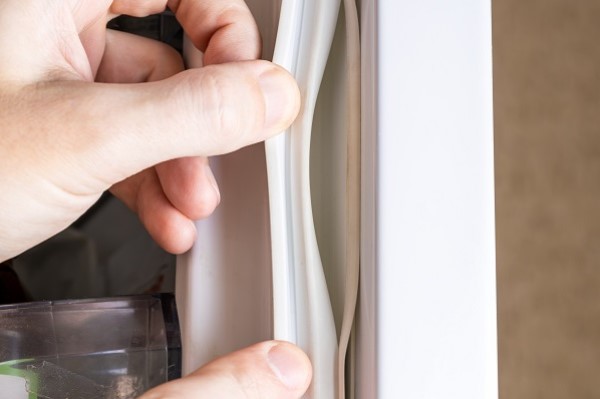 What are refrigerator door seals and why do they need to be cleaned?